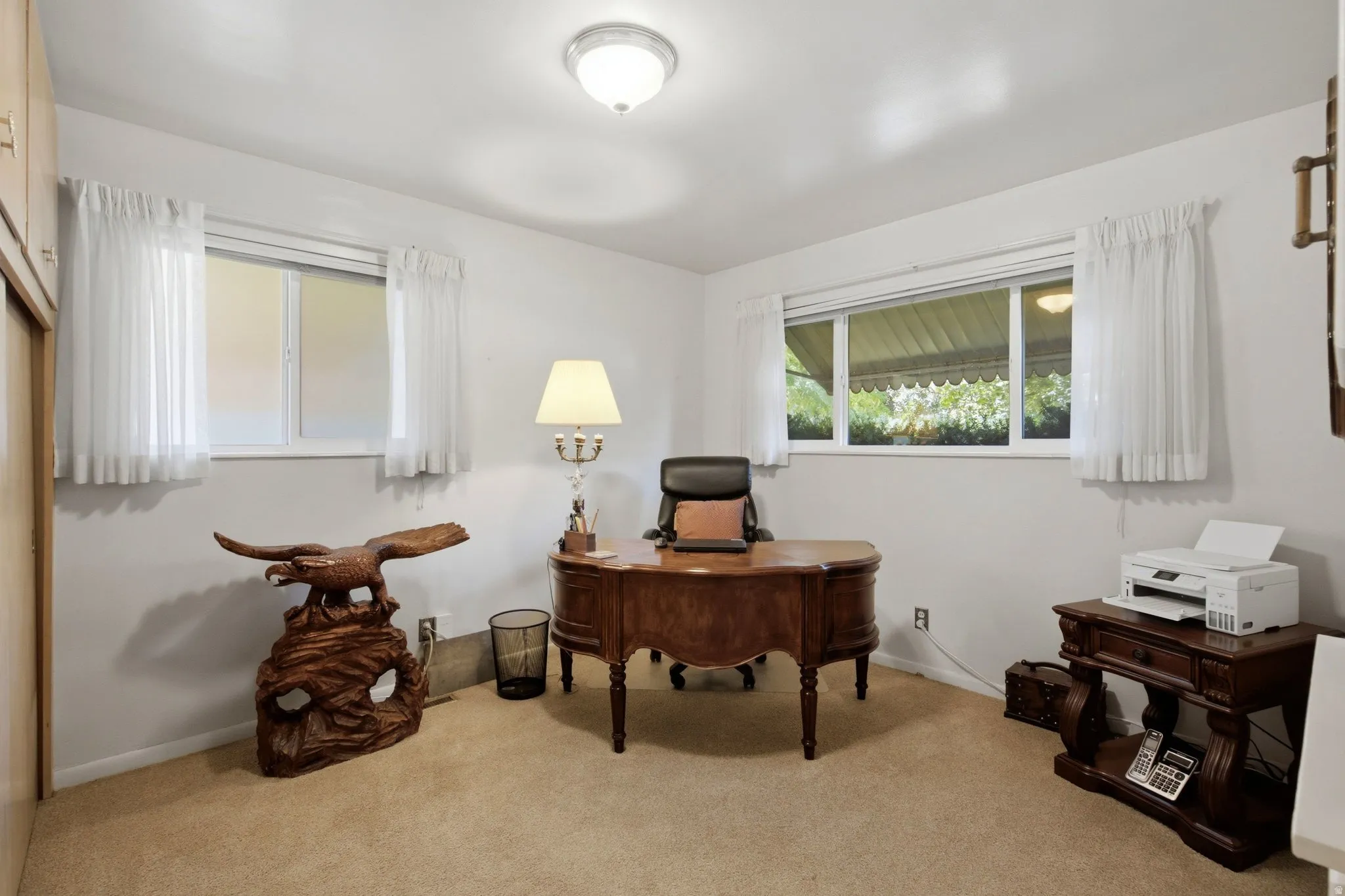 Recessed lighting and two windows with white trim