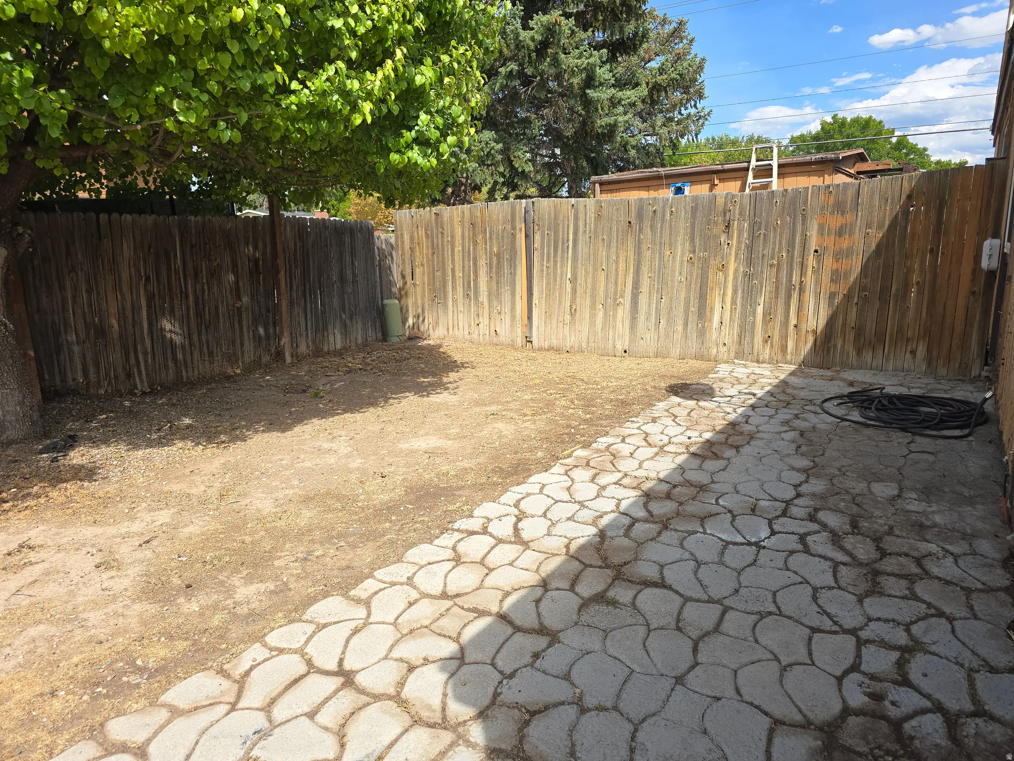 Paved patio area featuring decorative stone-look pavers