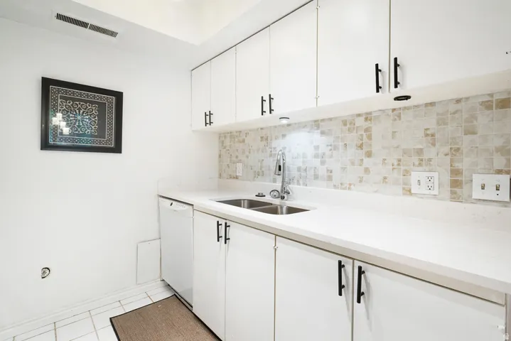 White cabinetry with matte black hardware