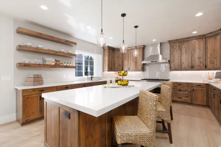 Expansive kitchen island with a white countertop and seating
