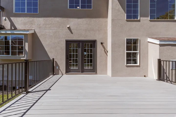 Spacious outdoor deck with a light-toned surface