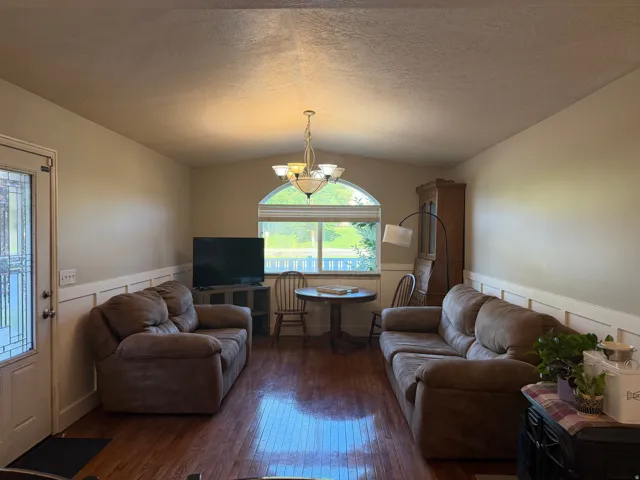Family room off kitchen area with hardwood-finish flooring