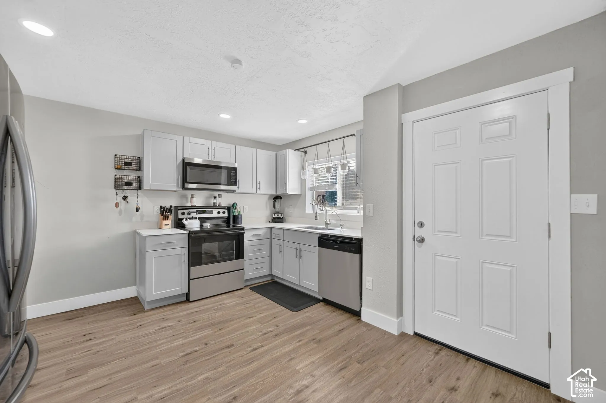 Stainless steel appliances, updated cabinetry and granite countertops.