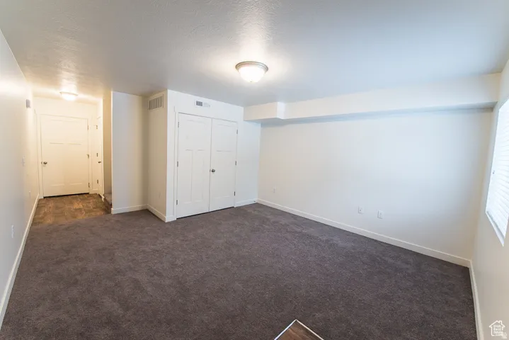 Gray carpeting and white walls