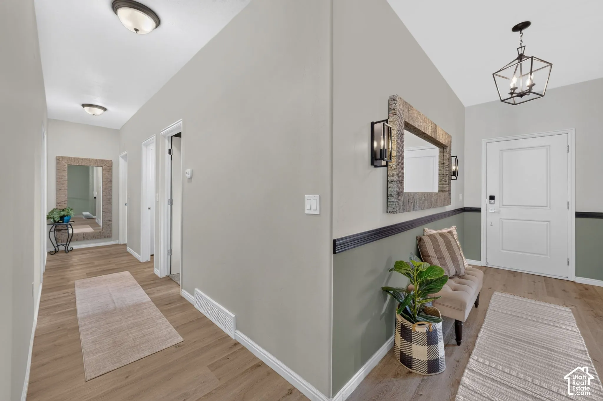 Hardwood-finish flooring, recessed lighting, ceiling-mounted light fixture, and paneled interior doors