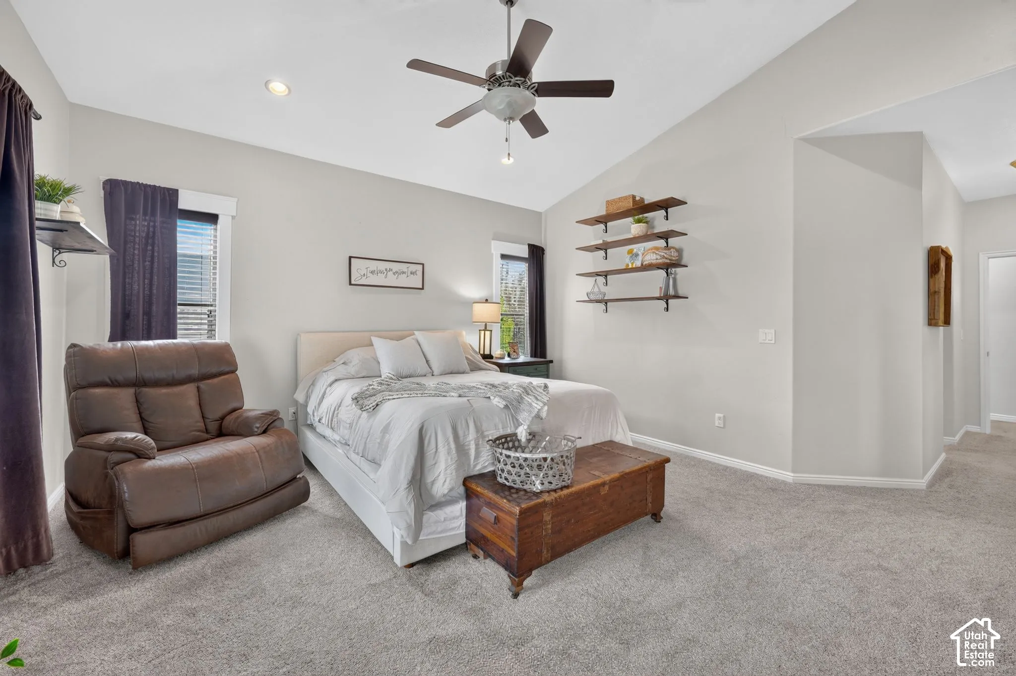 Vaulted ceiling featuring a ceiling fan, recessed lighting, and carpet flooring