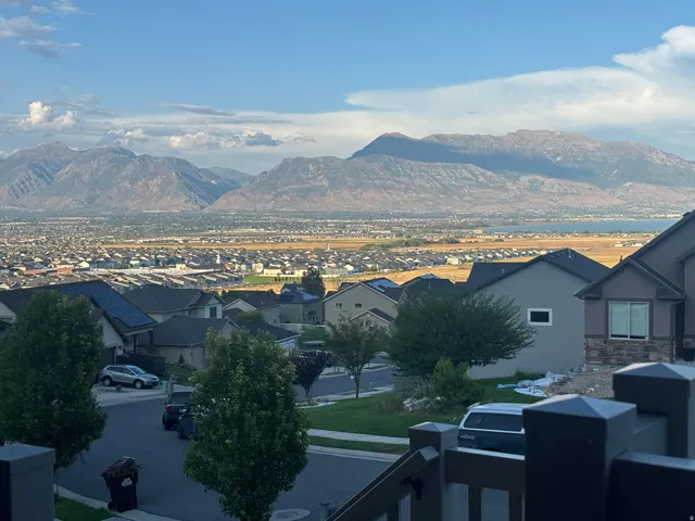 View from the front porch.  Expansive mountain backdrop with a distant body of water