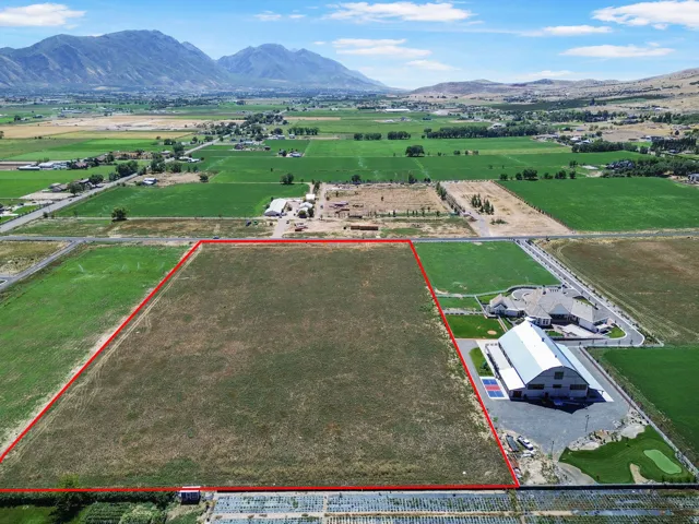 Expansive rural acreage with mature landscaping and mountain scenery