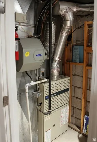 Furnace system with attached whole-house humidifier, exposed ductwork, and structural wood framing