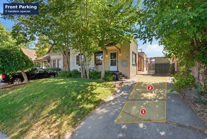 Convenient off-street front parking layout featuring 2 designated tandem spaces located right along the primary entrance driveway.
