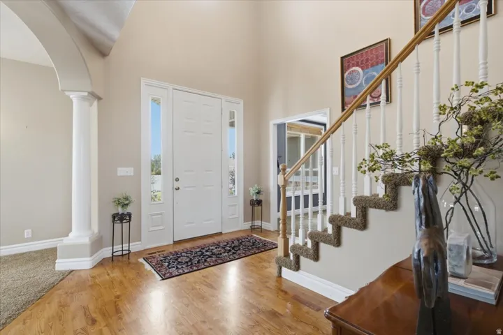 Two-story foyer with wood-finish flooring