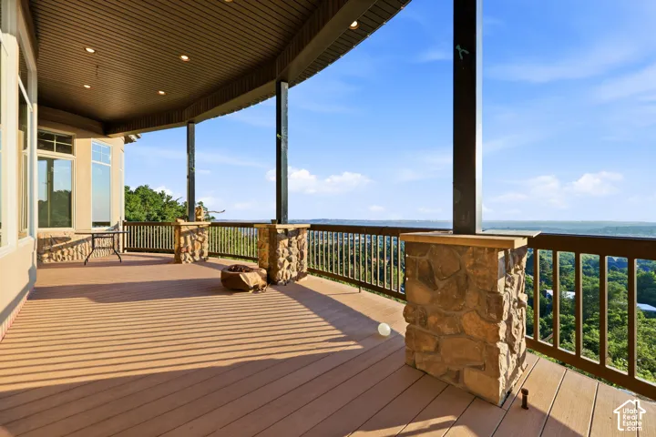 Expansive covered deck with panoramic view.