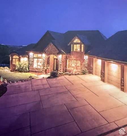 Stone veneer exterior with an arched entryway