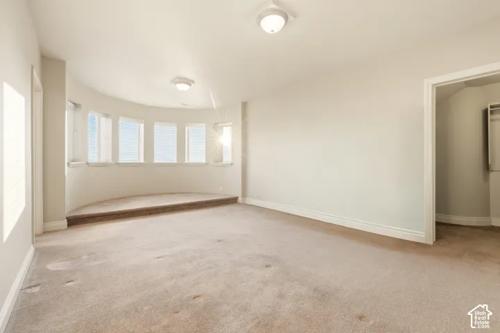 Daylight level master bedroom suite with bathroom and west view