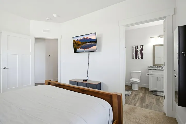 White interior walls with a white panel door