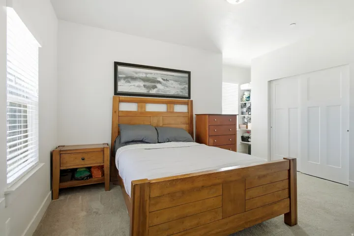 Recessed lighting, light gray carpet, and white walls