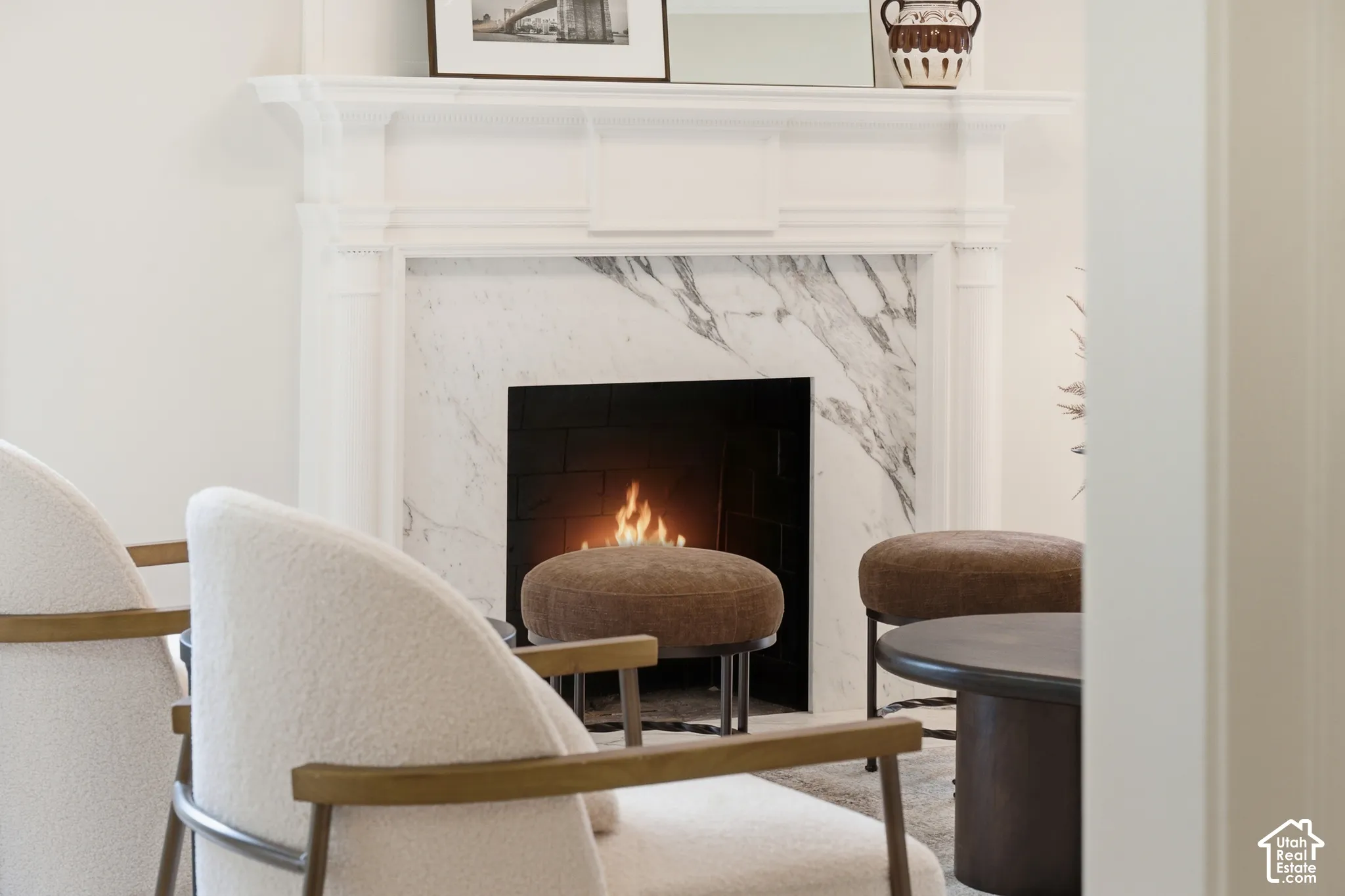 Fireplace with a white mantel and a natural stone surround