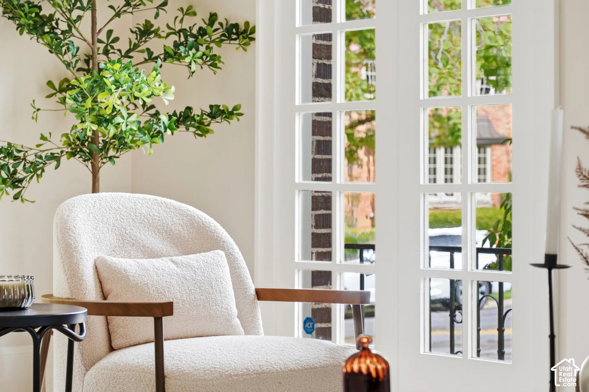 Original white French doors with multiple window panes looking out over historic Federal Heights