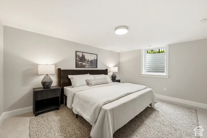Recessed window with white trim, wall-to-wall carpeting, and a flush-mount ceiling light