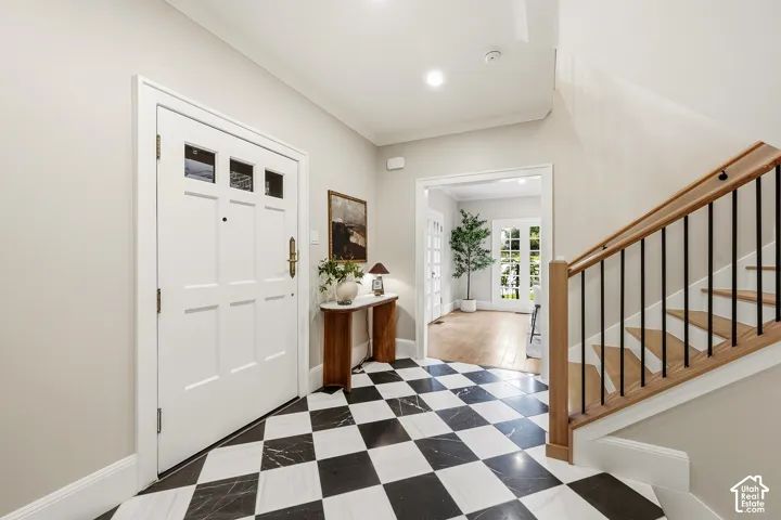 Entry foyer featuring black and white checkered marble floor tiling
