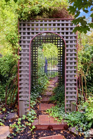 Garden trellis archway with an integrated gate