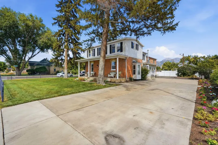 Brick and siding exterior with a covered porch