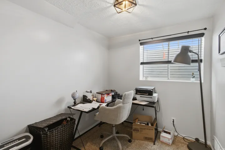 Recessed window with blinds and dark-finish rod
