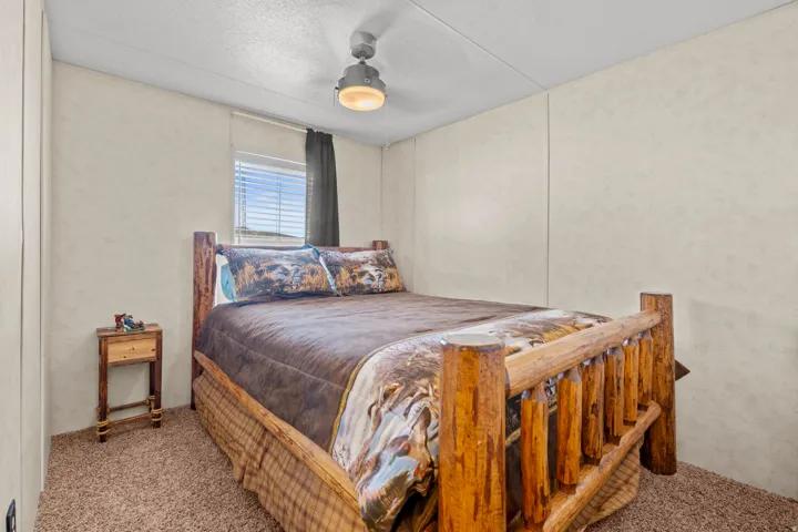 Second bedrooom with ceiling fan.