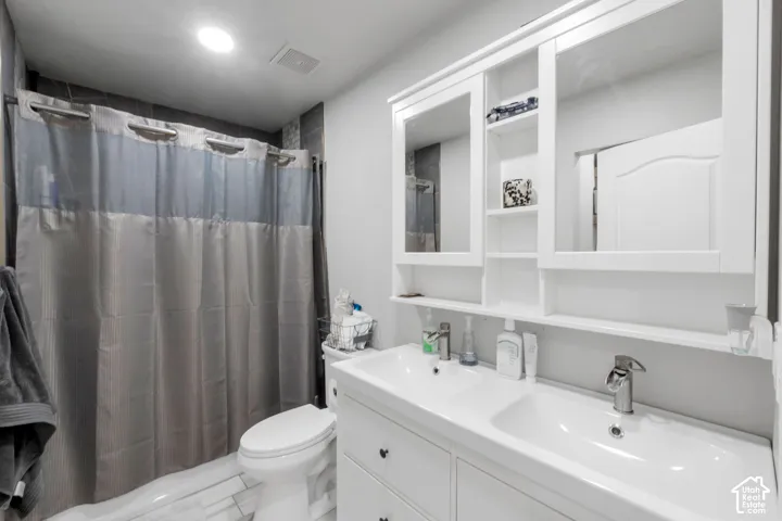 Main bathroom featuring double vanity