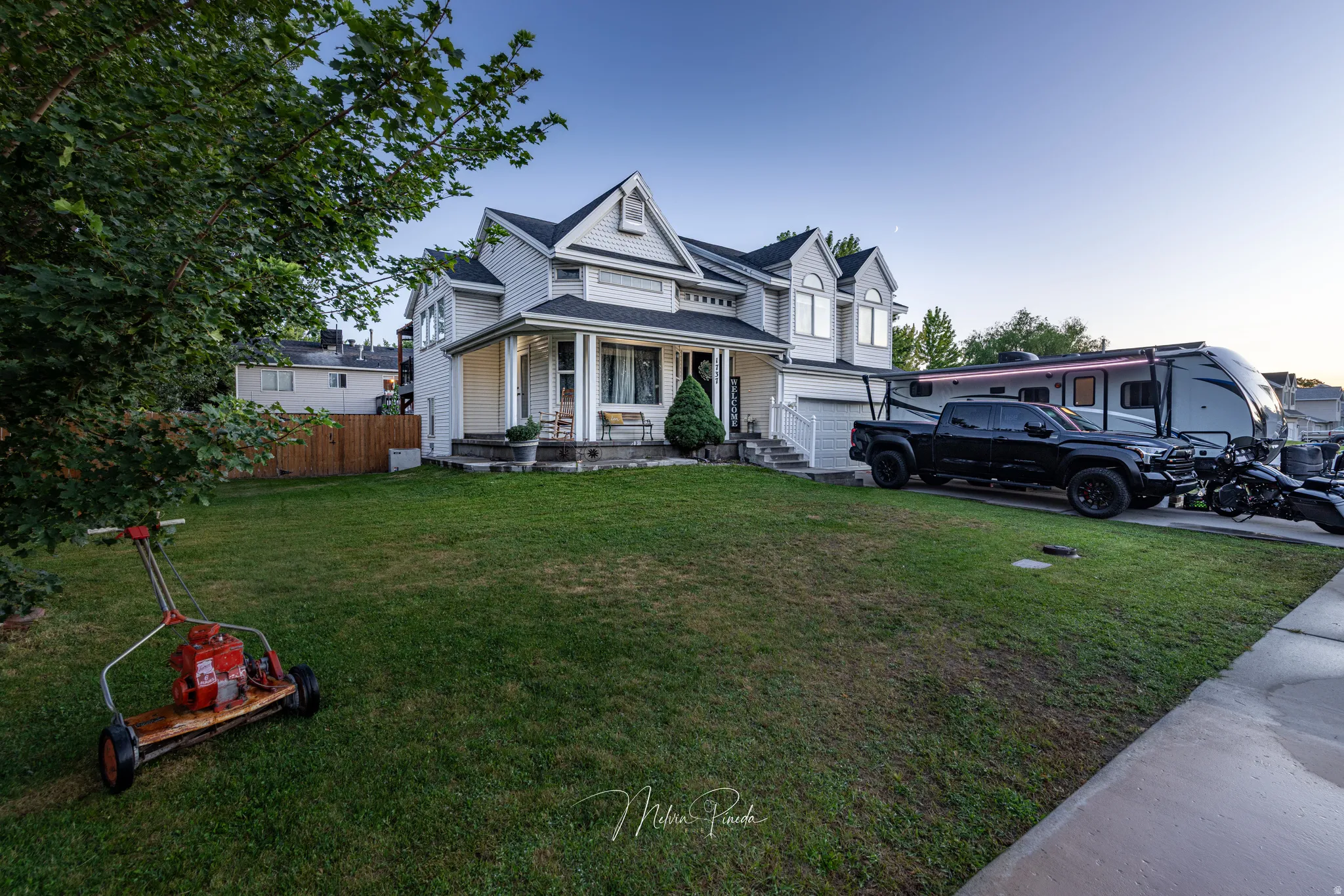 Two-story residence with a covered front porch and dormer windows