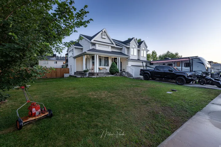 Two-story residence with a covered front porch and dormer windows