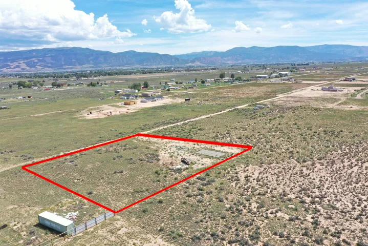 Expansive undeveloped parcel with a distant mountain backdrop