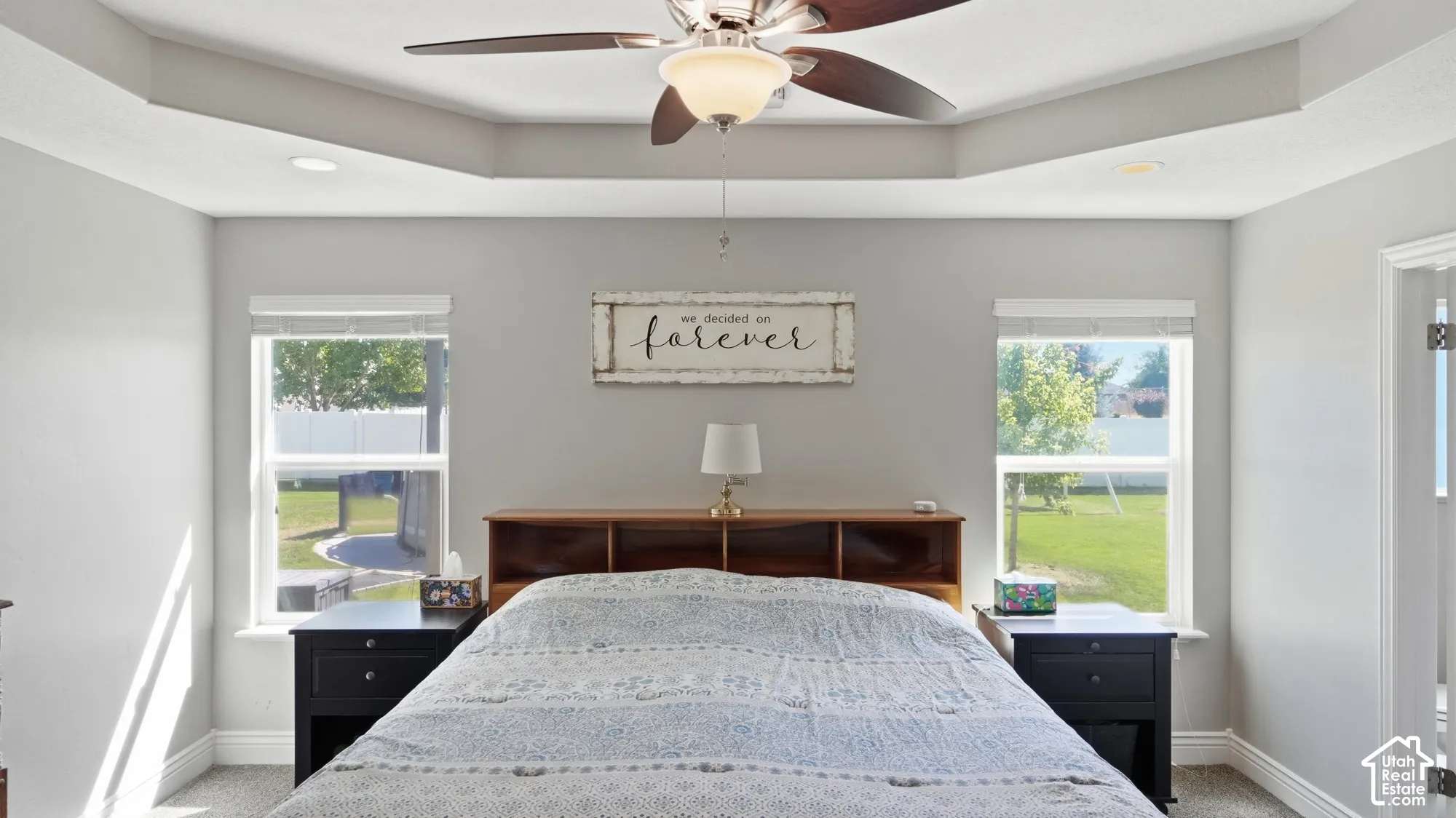 Tray ceiling with recessed lighting and a ceiling fan