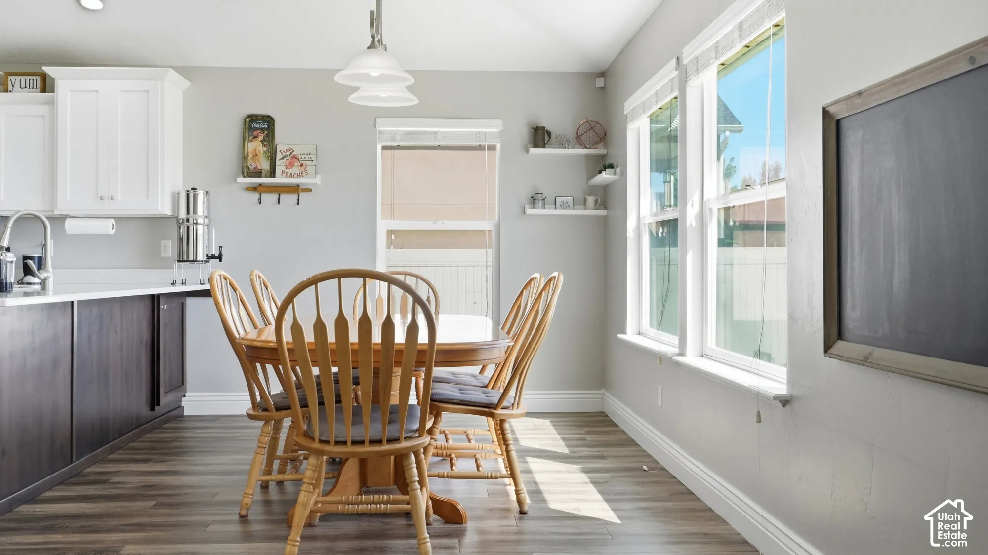 Wood-finish flooring with white baseboards