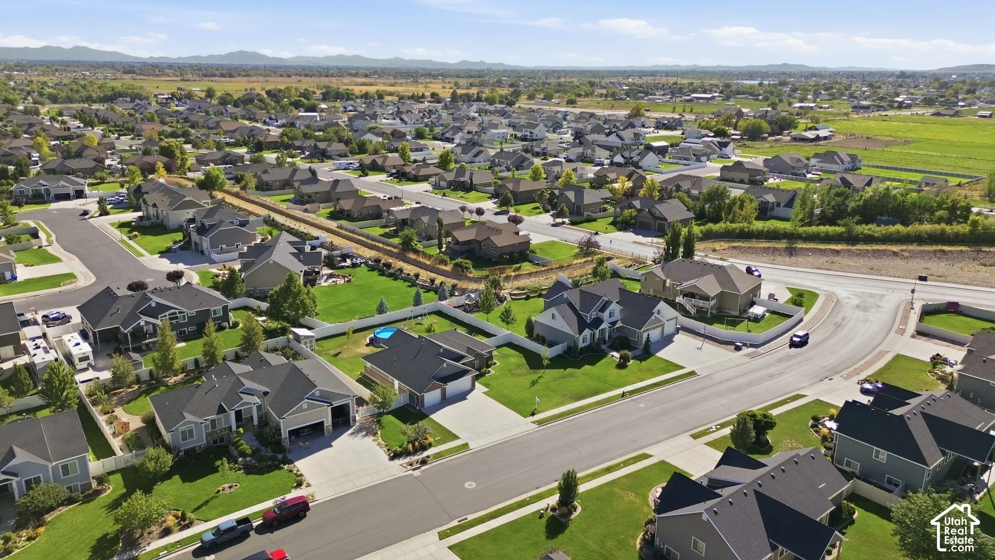 Residential neighborhood with established homes, paved streets, and green landscaping