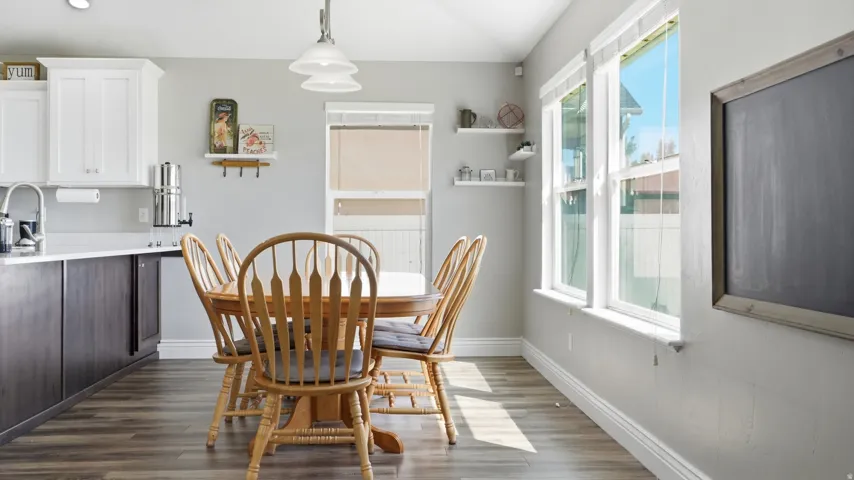 Wood-finish flooring with white baseboards