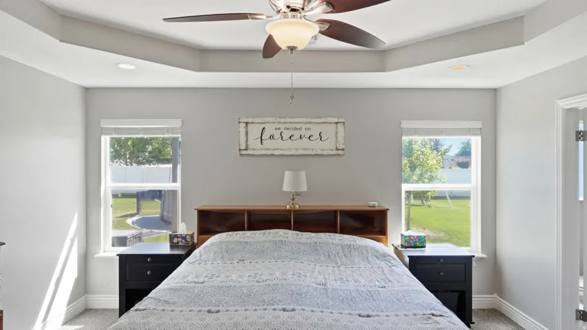 Tray ceiling with recessed lighting and a ceiling fan