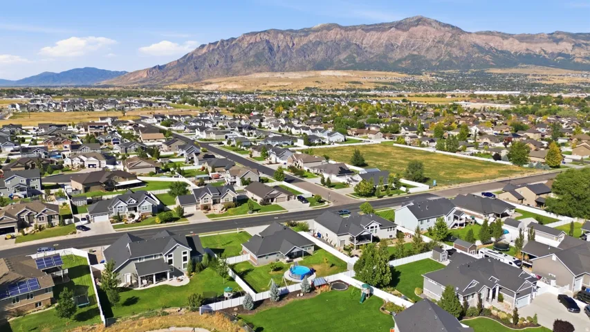 Expansive neighborhood with diverse residential architecture and landscaped properties