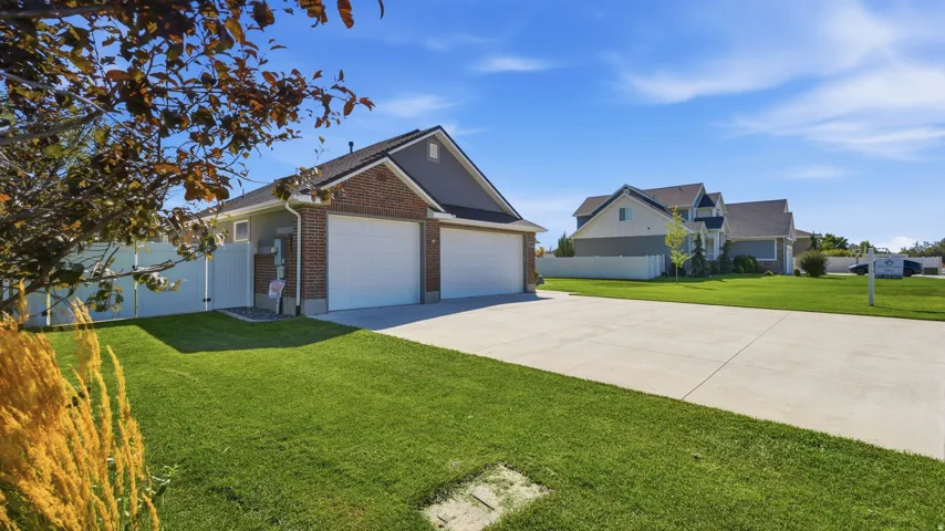 Brick and siding exterior with a two-car garage