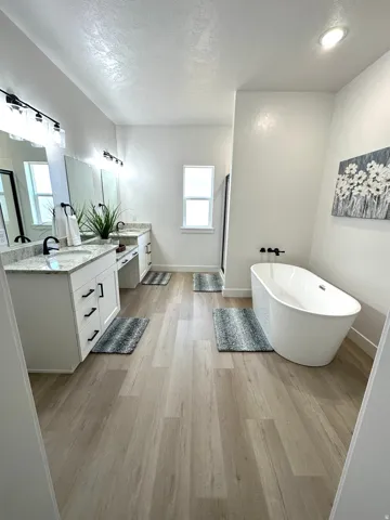 Dual vanity with undermount sinks and granite-style countertops