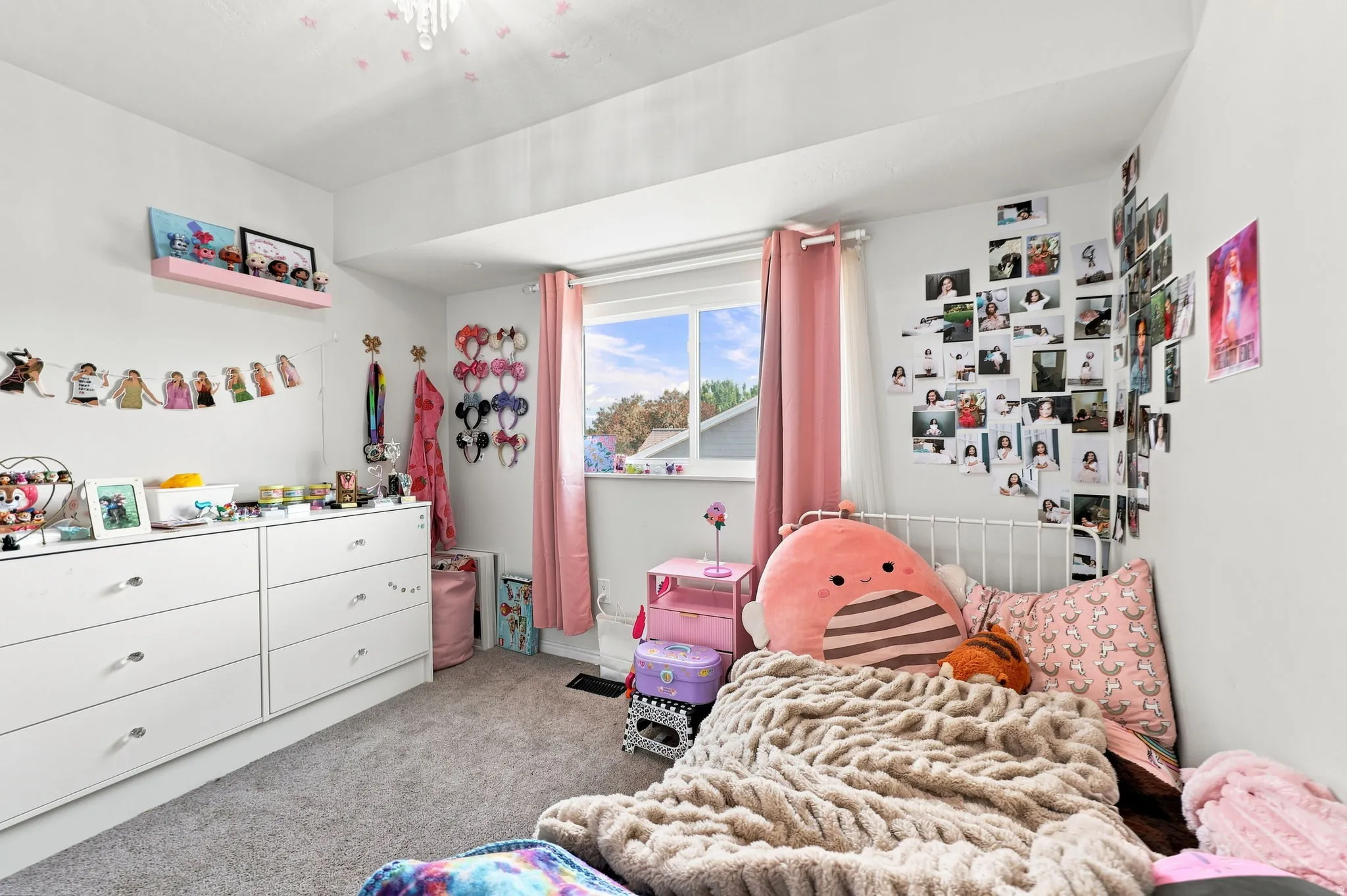 White walls with recessed window and pink drapes