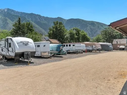 Unpaved parking area with open-air storage for recreational vehicles
