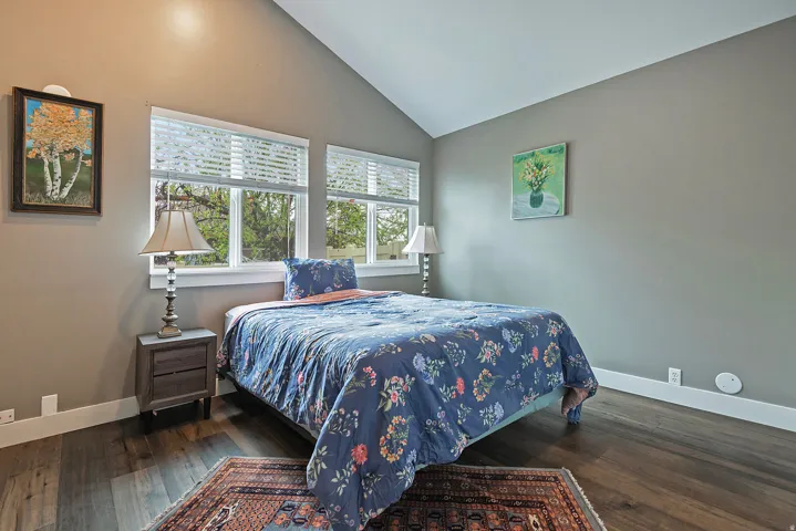 Vaulted ceiling with wood-finish flooring