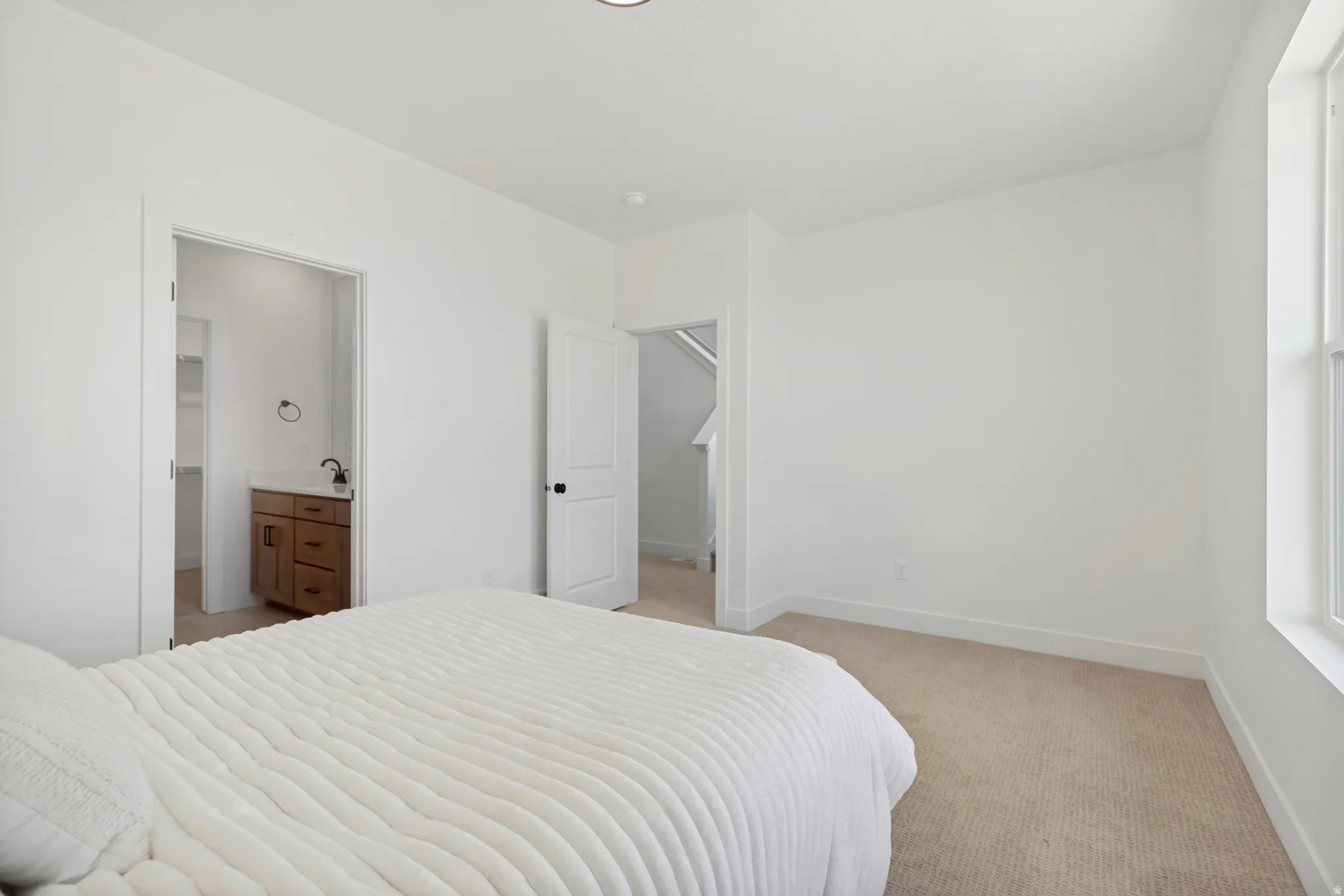 Neutral-toned carpeting throughout