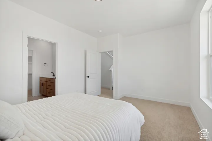 Neutral-toned carpeting throughout