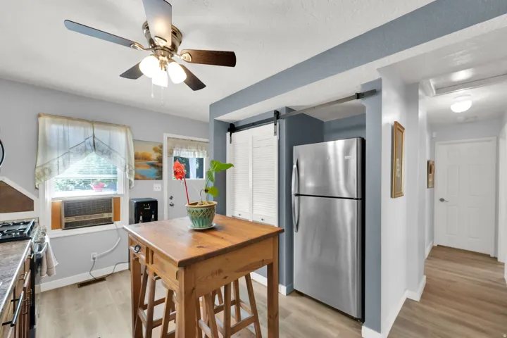 Wood-finish flooring throughout the space