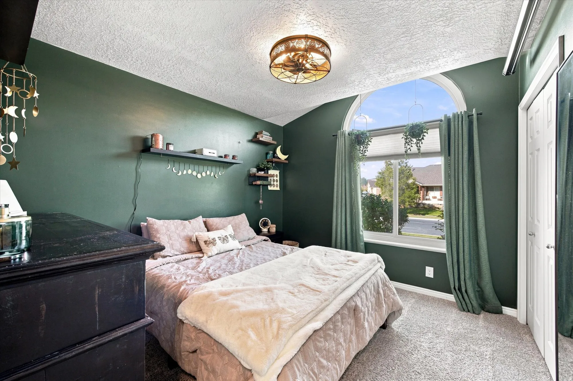 Arched window with light-filtering blinds