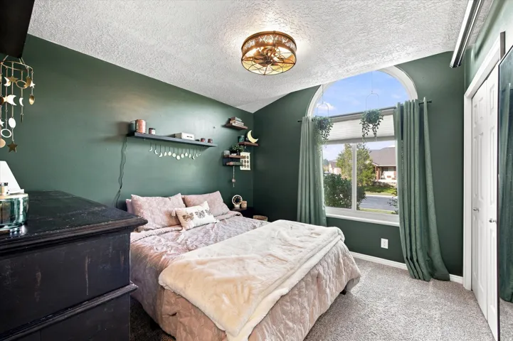 Arched window with light-filtering blinds