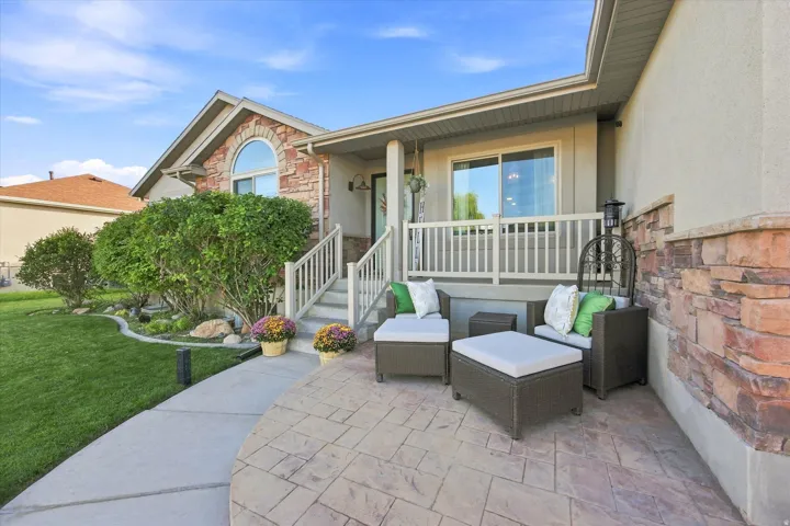 Stamped concrete patio with stone veneer facade