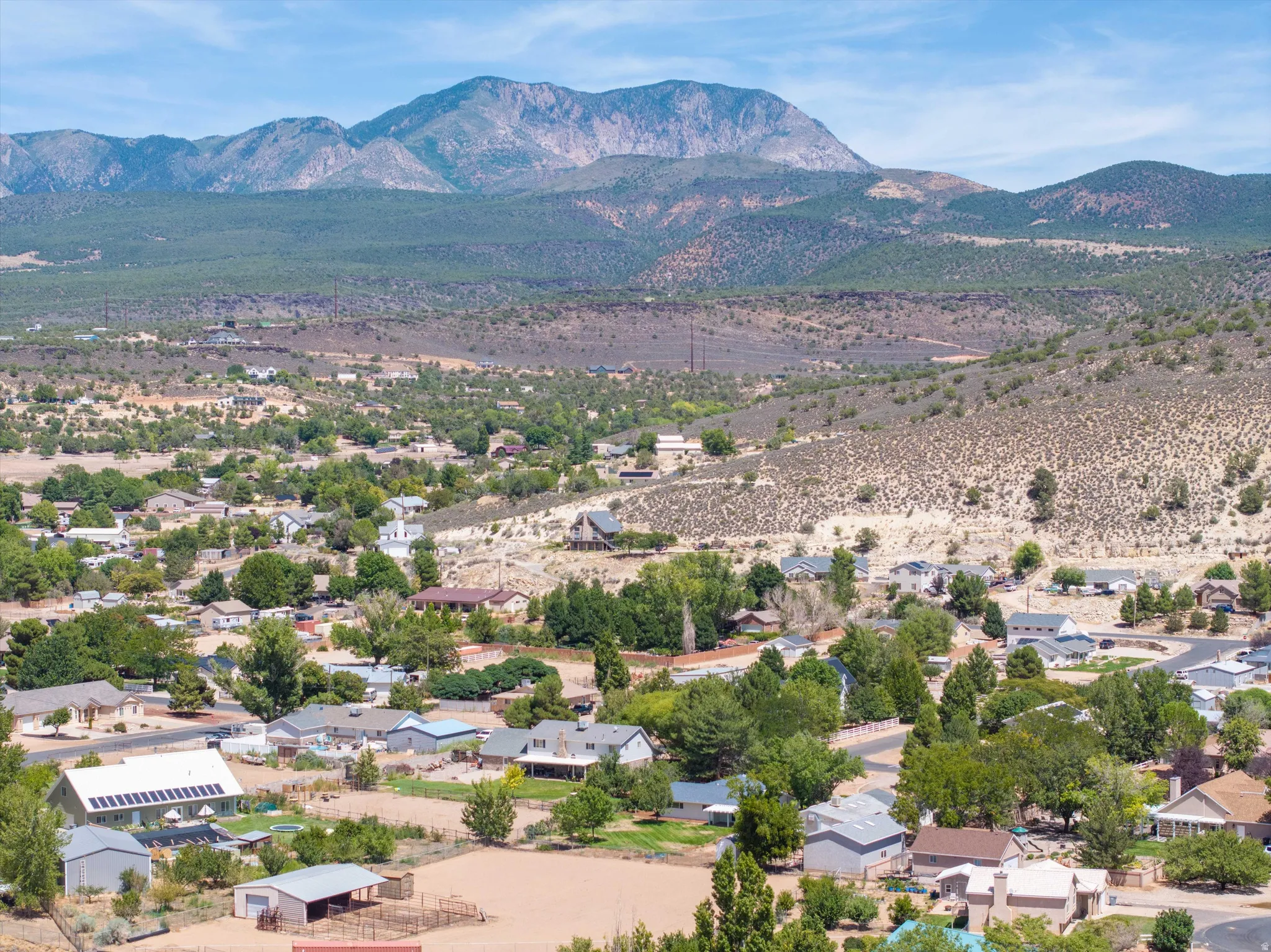 Mountain backdrop with a residential area featuring multiple single-family homes